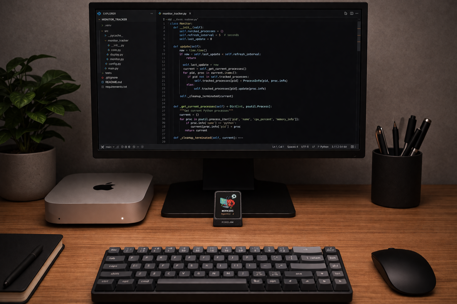 Desk with monitor, keyboard, and PixClaw device showing pixel status below the screen